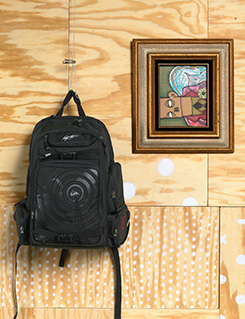 backpack on plywood wall