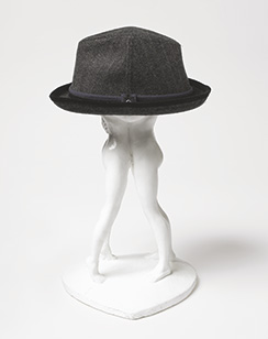 men's hat on statue